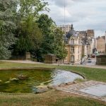 A small pond in the middle of a park